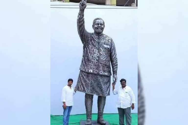 Statue of Prime Minister Modi by automobile scrap