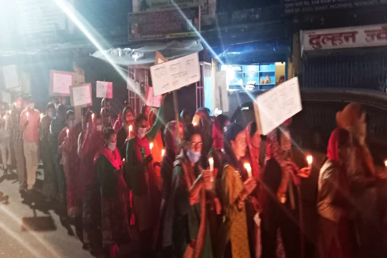 candle march against THDC