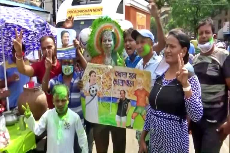 TMC supporters celebrate outside CM Mamata Banerjees residence in Kolkata