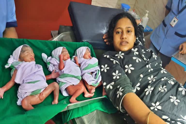 woman gives birth to three children