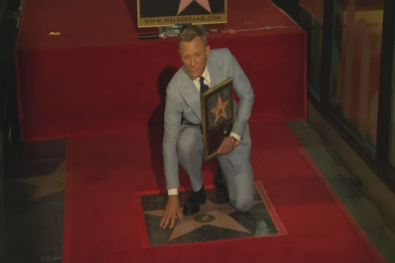 Daniel Craig jokes ‘he’s honored to get walked all over in Hollywood’ as he gets a star on Walk of Fame