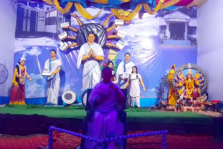 mamata banerjee depicted as goddess durga-with-hands-full-of-schemes