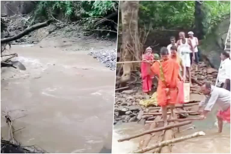 bridge-washed-out-from-heavy-rain-causes-problems-to-reach-temple