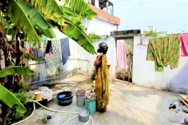 a family members in nakrekal wear helmet in view of sparrow nest