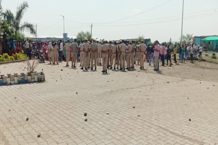 workers pelted stones at police in Jhalarapatan