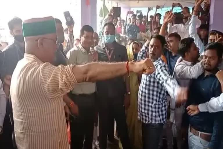 Bhupesh Baghel getting whipped as part of a ritual