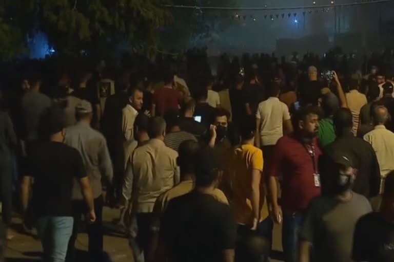 Shiite militia supporters face police in Baghdad