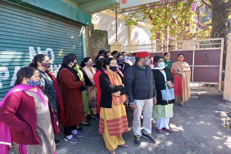 Parents protested silently outside the school