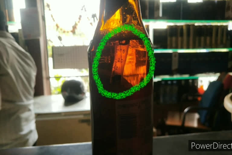 Syringe in beer bottle
