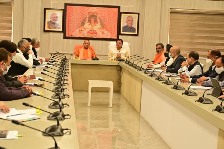 CM Dhami UP CM Yogi meeting