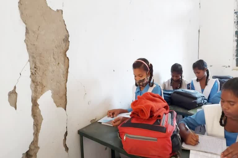 students studying in the middle of the fallen roof