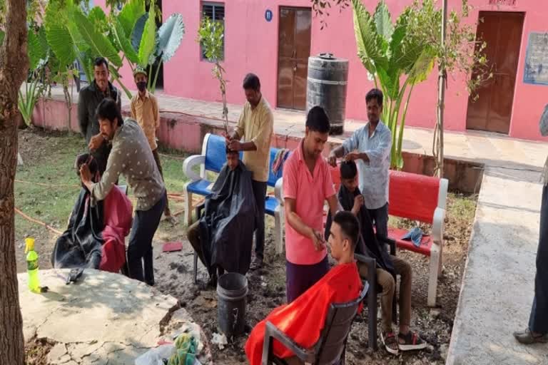 Barber cuts hair in Bhilwara government school