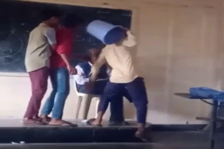 students-put-dustbin-bucket-on-teacher-head-in-school