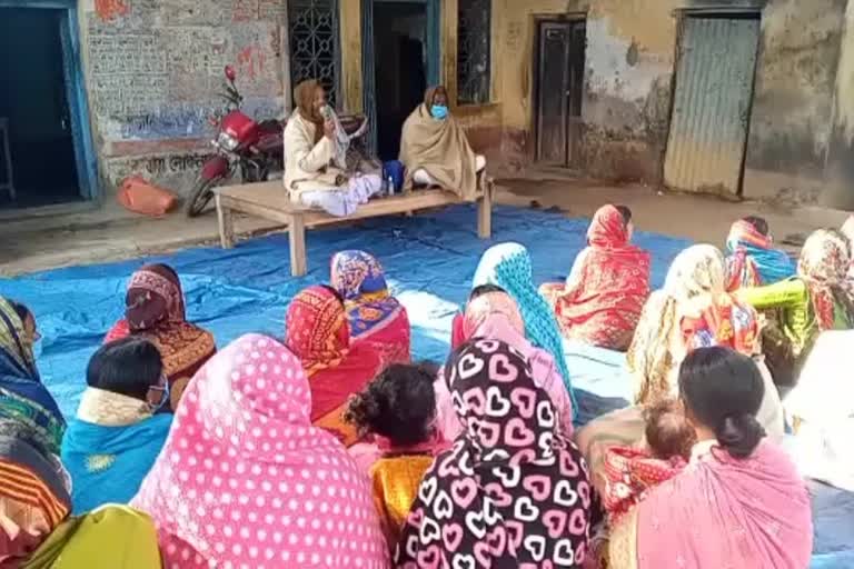 women shows an agitation for pipe line water service