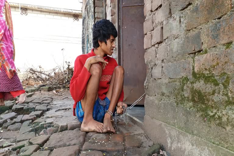 youth chained by family in medinipur town