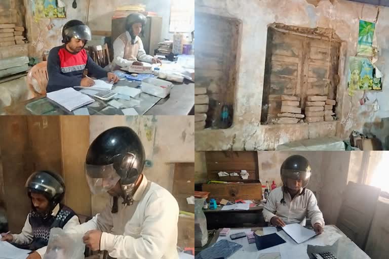 Helmets for protect themselves with a ceiling in Bihar  Bihar State Road Transport Corporation office  employees wear the helmet throughout the working time  ബീഹാറിൽ മുൻഗർ ജില്ലയിൽ ഹെൽമെറ്റ് വെച്ച് ജോലിചെയ്യുന്ന ഉദ്യോഗസ്ഥർ  മുൻഗർ ജില്ലയിലെ സ്റ്റേറ്റ് റോഡ് ട്രാൻസ്‌പോർട്ട് കോർപ്പറേഷൻ  ഓഫീസിൽ ഹെൽമെറ്റ് ധരിച്ച് ഉദ്യോഗസ്ഥർ