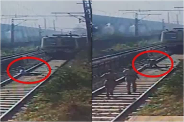 man suicide attempt railway track  railway police rescue man in mumbai  shivdi railway station suicide attempt  റെയില്‍വേ പാളം ആത്മഹത്യ ശ്രമം  ശിവ്‌ഡി റെയില്‍വേ സ്റ്റേഷന്‍ ആത്മഹത്യ ശ്രമം  മുംബൈ റെയില്‍വേ ട്രാക്ക് ആത്മഹത്യ ശ്രമം രക്ഷപ്പെടുത്തി