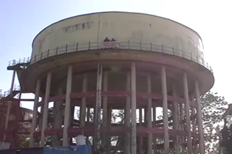 PWD contract workers climb on water tank demanding regularization-in-parade-ground