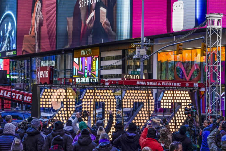 The city authorities said it would limit the number of people it lets into Times Square to witness a 6-ton ball, encrusted with nearly 2,700 Waterford crystals, descend above a crowd of about 15,000 in-person spectators — far fewer than the many tens of thousands of revelers who usually descend on the world-famous square to bask in the lights, hoopla and shower of confetti during the nation’s marquee New Year’s Eve event.