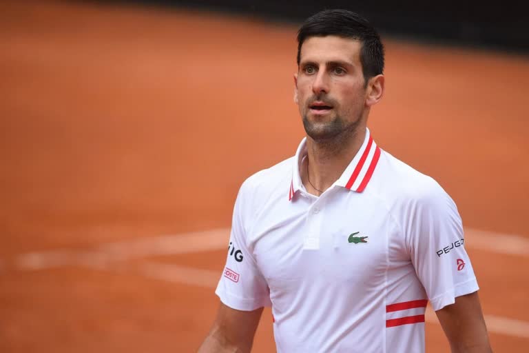 Tennis top-ranked Djokovic spends religious day in detention