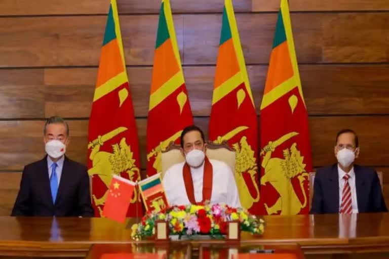 Chinese FM Wang Yi visits Sri Lanka and meets sri lanka pm rajapaksa