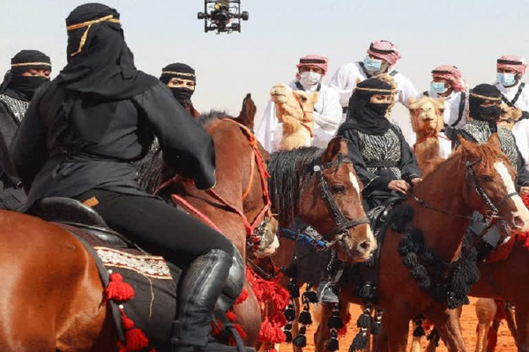 In Saudi Arabia, women debut in camel beauty contest