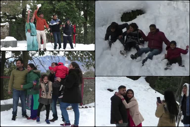 TOURIST ENJOYING SNOWFALL IN DALHOUSIE