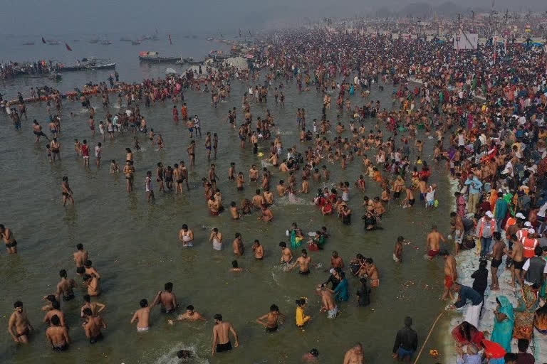 Amidst surge in COVID-19 cases, crowds of devotees take holy dip in Ganga on the occasion of Makar Sankranti on Friday defying COVID guidelines.