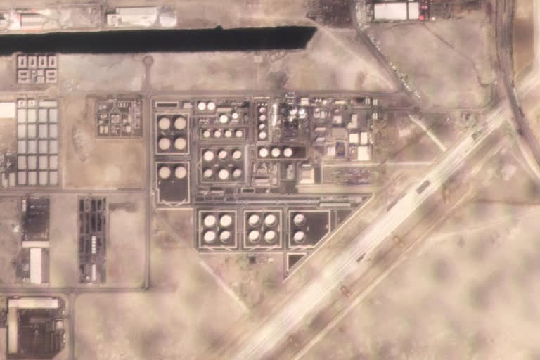 In this satellite image provided by Planet Labs PBC, white fire suppressing foam is seen after an attack on an Abu Dhabi National Oil Co. fuel depot in the Mussafah neighborhood of Abu Dhabi, United Arab Emirates, Monday, Jan. 17, 2022. A drone attack claimed by Yemen's Houthi rebels targeting a key oil facility in Abu Dhabi killed three people on Monday and sparked a fire at Abu Dhabi's international airport.