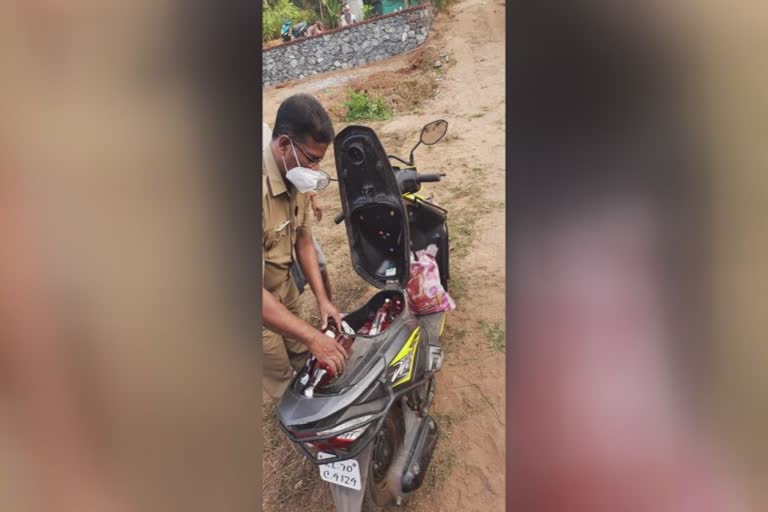 Nenmara Palakkad foreign liquor smuggle  Police seized 12 liters of foreign liquor Nenmara  Palakkad foreign liquor seized while trying to smuggle it on a scooter  പാലക്കാട് സ്‌കൂട്ടറിൽ കടത്താൻ ശ്രമിച്ച 12 ലിറ്റർ വിദേശമദ്യം പിടികൂടി  നെന്മാറ സ്‌കൂട്ടറിൽ കടത്താൻ ശ്രമിച്ച മദ്യം പിടികൂടി  നെന്മാറ പാലക്കാട് വിദേശമദ്യക്കടത്ത്