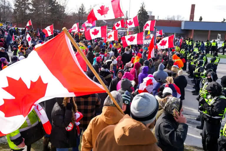 Canada's House of Commons cancelled its work on Friday amid rapidly increasingly signs police were about to begin breaking up the three-week protest by hundreds of truckers angry over the country's COVID-19 restrictions.