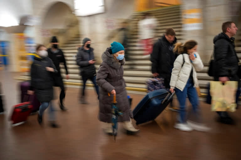 Civil defense sirens wailed in the air of the capital, Kyiv, in the gray and drizzly morning, but the city's main street Khreshchatyk was a mixture of anxiety and normalcy.