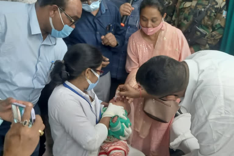 Health Minister Banna Gupta launches polio campaign by giving polio drops to children