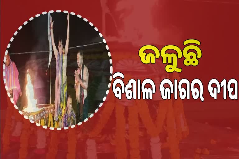 lighting the largest jagara lamp in lokanath temple at puri