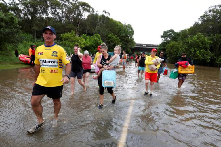 Scores of residents, some with pets, spent hours trapped on their roofs in recent days by a fast-rising river in the town of Lismore in northern New South Wales state.