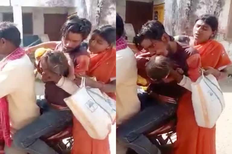 Father giving mouth oxygen to save child