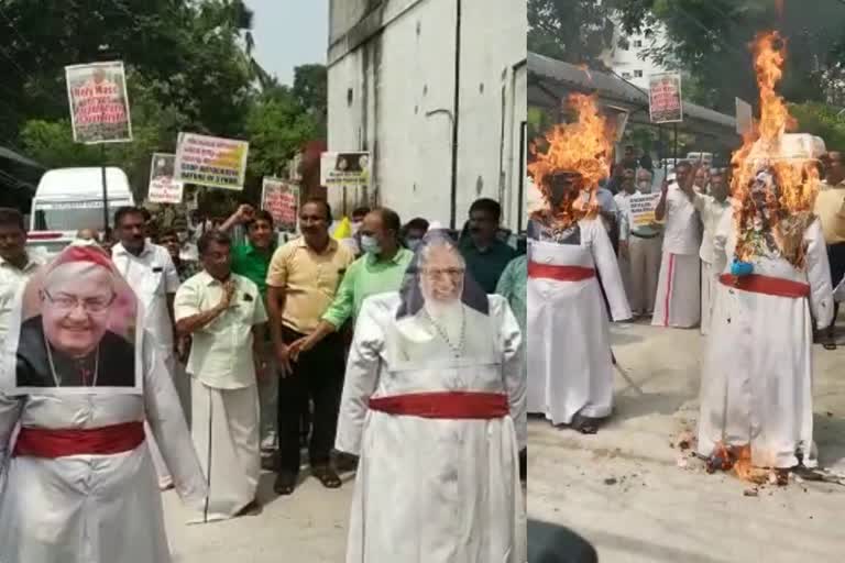 Ernakulam Church Mass Unification protest  Church Mass Unification Believers burn the effigy of Cardinal George Alencherry  സിറോ മലബാർ സഭാ ആർച്ച് ബിഷപ്പ് കർദിനാൾ ജോർജ് ആലഞ്ചേരി  Syro Malabar Church Archbishop Cardinal George Alencherry  കർദിനാൾ ആലഞ്ചേരിയുടെ കോലം കത്തിച്ച് വിശ്വാസികൾ  കർദിനാൾ സാന്ദ്രിയുടെ കോലം കത്തിച്ച് വിശ്വാസികൾ  കുർബാന ഏകീകരണം പ്രതിഷേധം  അൽമായ മുന്നേറ്റം അതിരൂപത സമിതി  Spiritual Advancement Archdiocesan Committee  ജനാഭിമുഖ കുർബാന