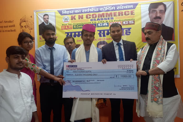 Minister Jivesh Mishra honored commerce topper