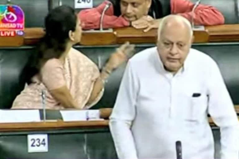 Shashi Tharoor chats with Supriya Sule as Farooq Abdullah gives a speech at Lok Sabha