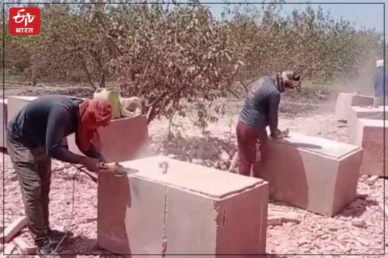 Workers doing the work of grinding stones