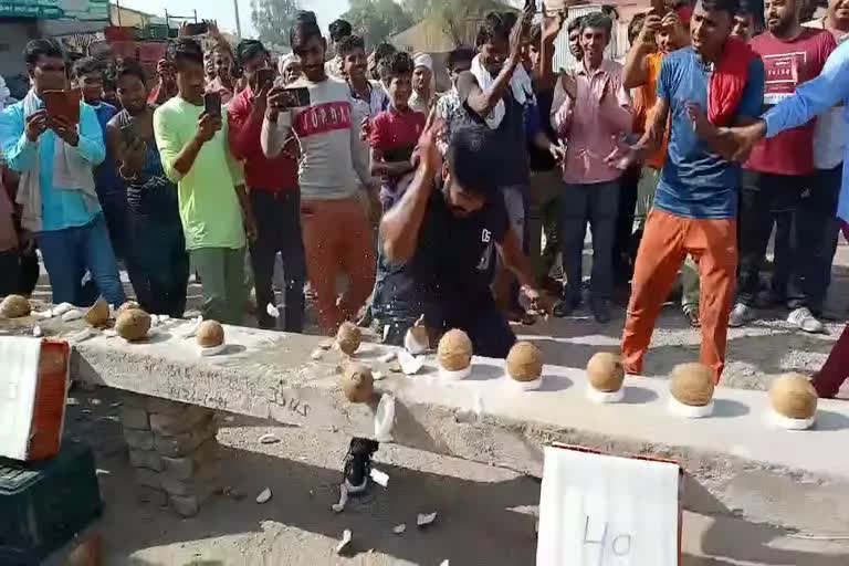 Coconut breaking with hand