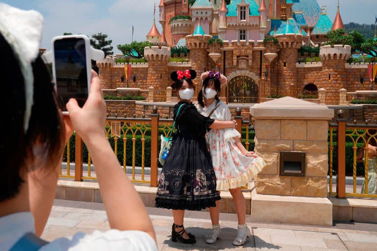 Hong Kong Disney opens as COVID eases; Shanghai deaths rise