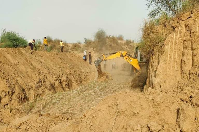 Pond digging with machines in bhind