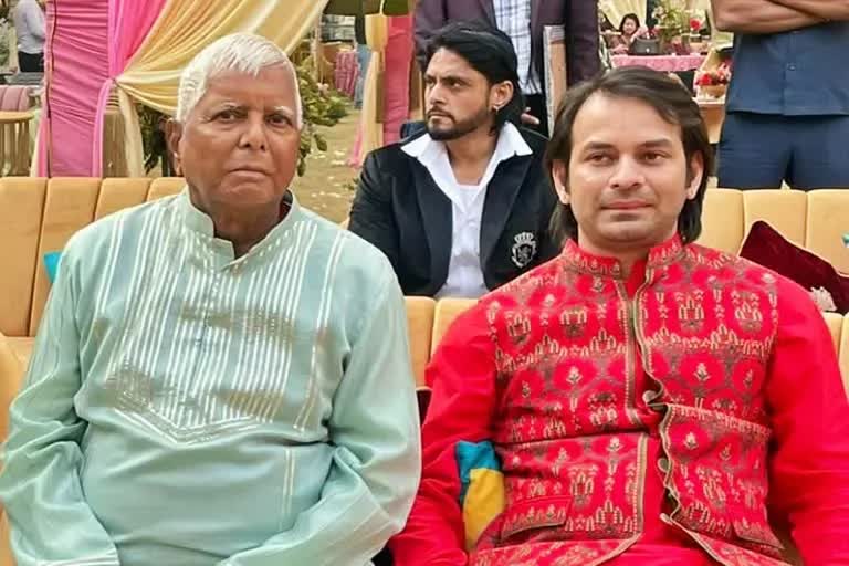 Tej Pratap Yadav with Lalu Yadav (File photo)