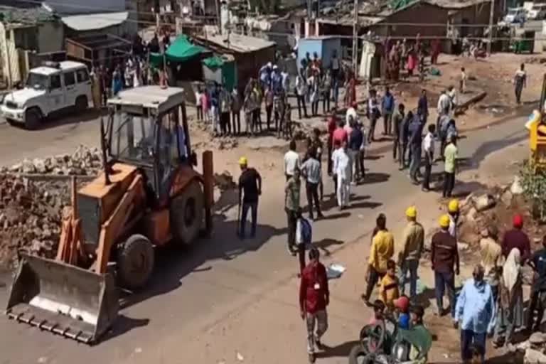 demolition drive begins in riot-hit Himmatnagar using Bulldozers