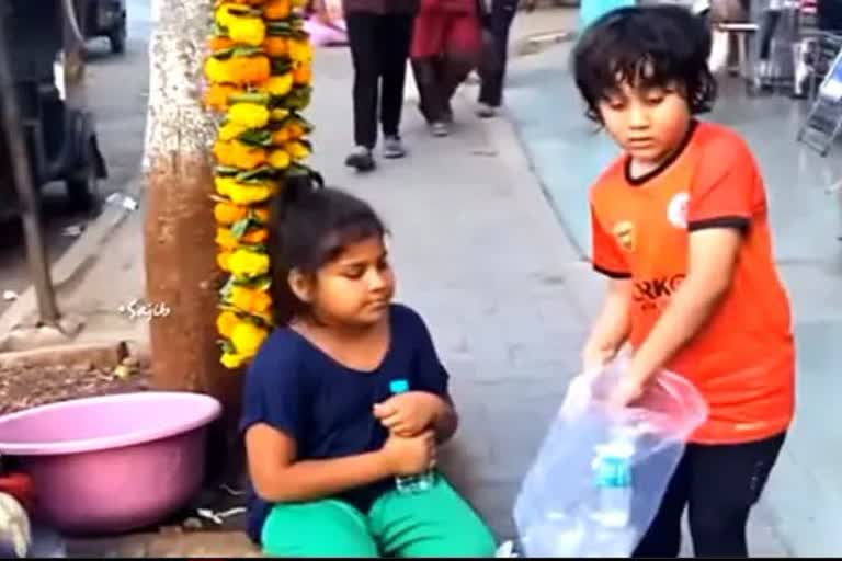 boy video giving water to street vendors