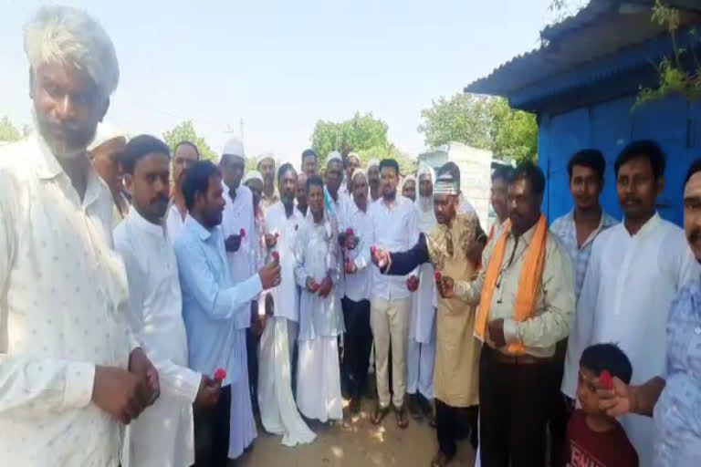 Basava devotees offering bouquets and greeting to Muslim relatives