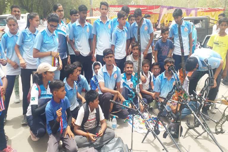 Players learning archery performed in the collectorate with bow and medal