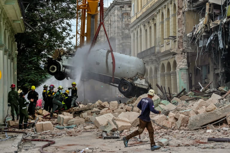 The shattered hotel remained cordoned off as workers operated heavy machinery to lift huge pieces of wall and masonry and trucks left the site loaded with rubble. Firefighters and rescue workers toiled inside the wreckage. Authorities refused to release the names of the dead, even to their relatives.