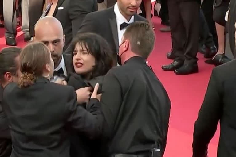 Stop raping us Topless woman storms Cannes red carpet to protest against sexual violence in Ukraine